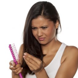 woman with a comb and excess hair