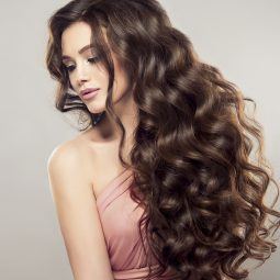 woman with long wavy thick hair curly