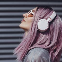Woman with headphones light purple hair lilac hair long bob