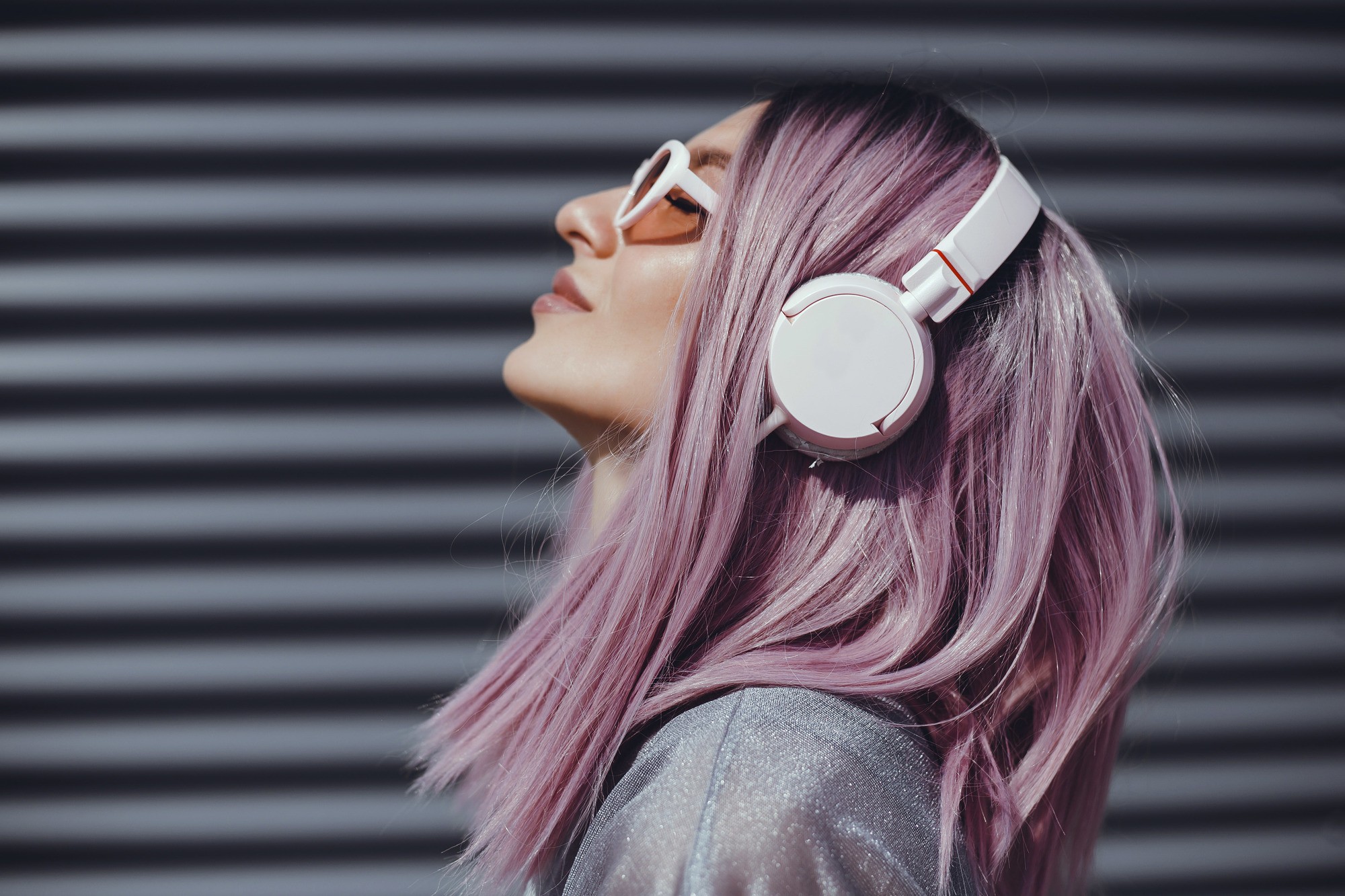 Woman with headphones light purple hair lilac hair long bob