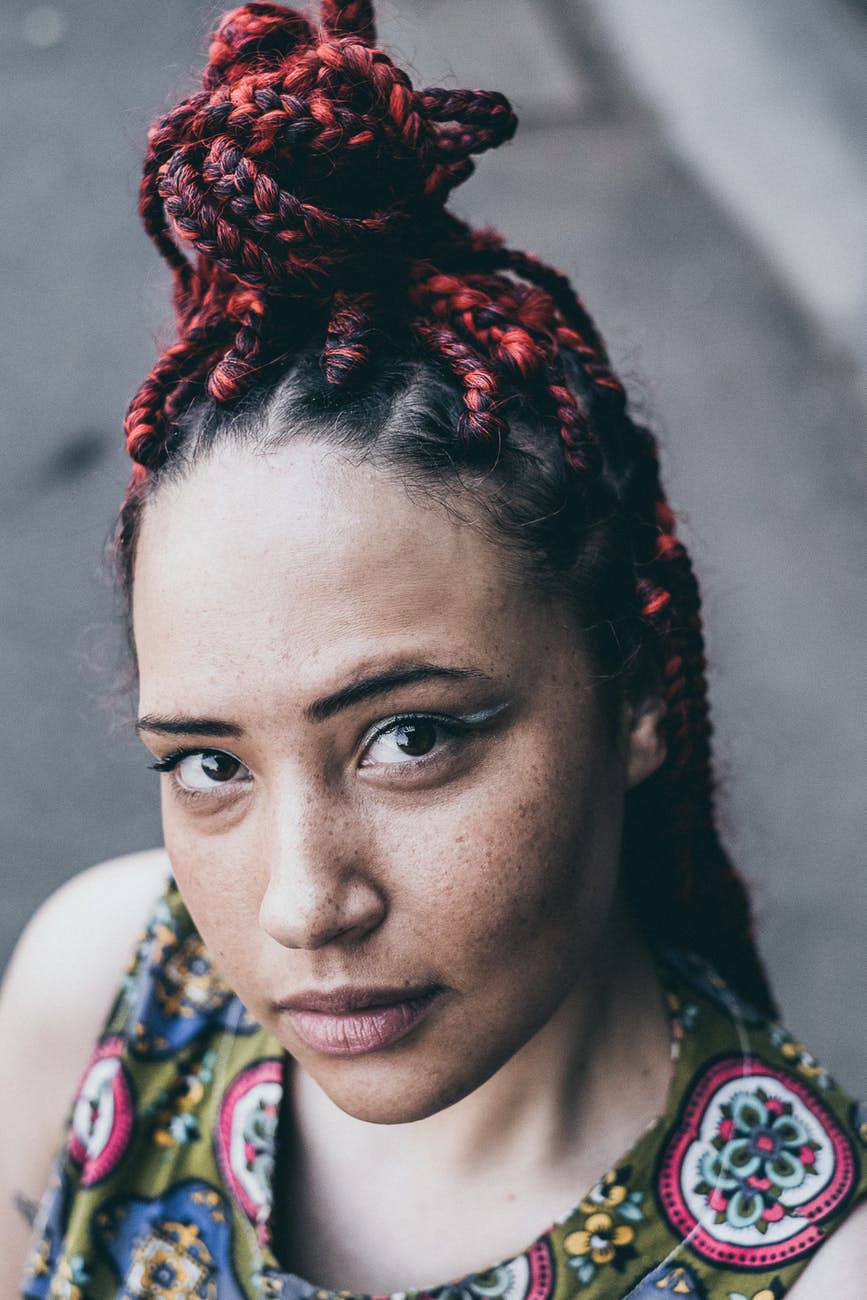woman with red and black box braids