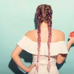 woman with pink ombre double dutch braids