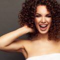 woman with corkscrew curls tight curly hair