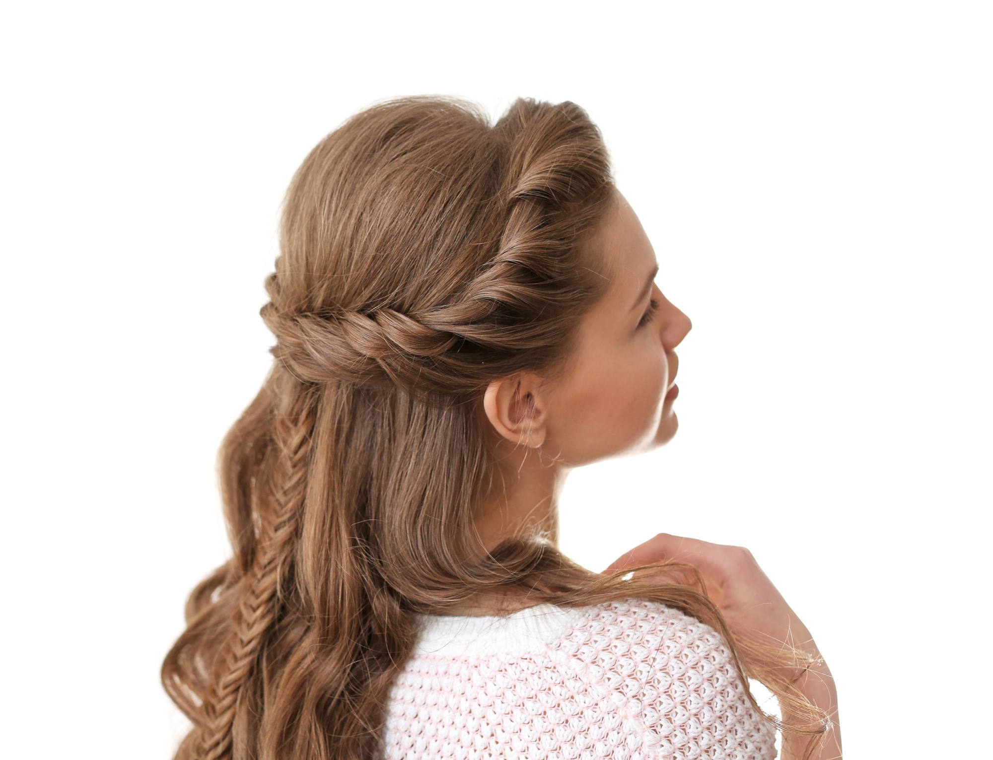 woman with brown hair waves and braids