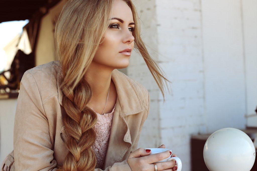 woman with long hair and a three-strand braid professional hairstyles