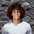 man with long curls