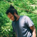 man with curly man bun and beard