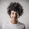 man with round face: natural curly hairstyle