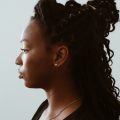 woman with curly hair and ponytail