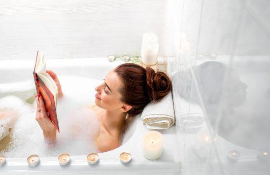 woman relaxing the bath hair in a bun