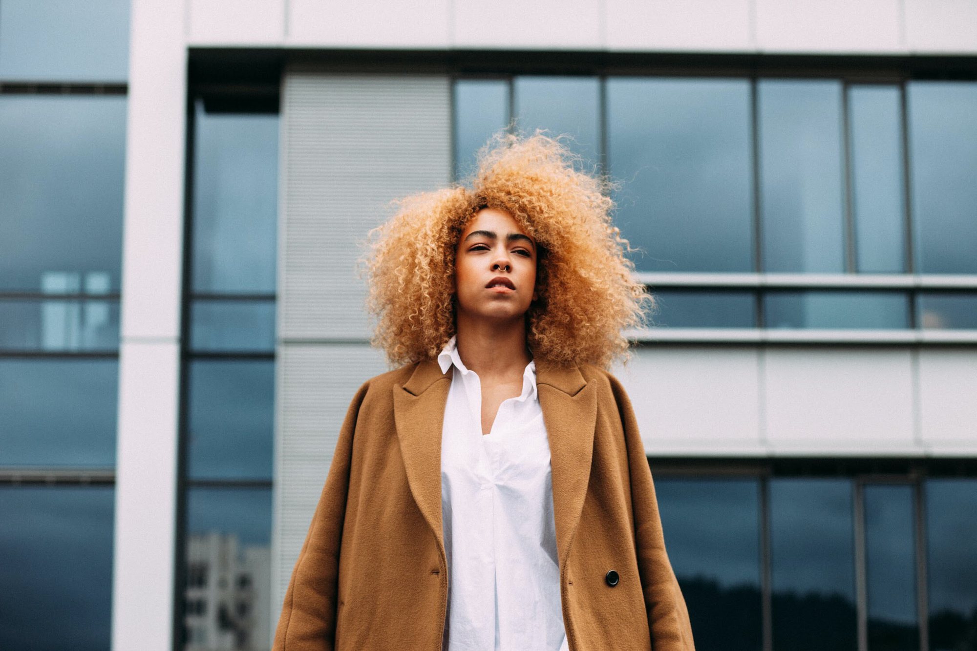 woman with big blonde curly hair