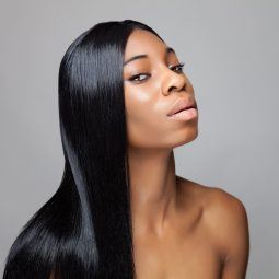 black woman with beautiful long hair, styles sleek and shiny