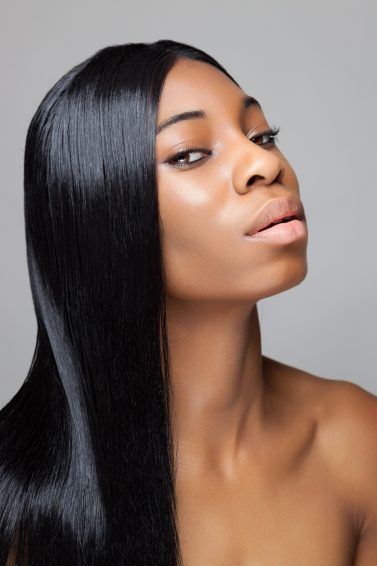 black woman with beautiful long hair, styles sleek and shiny
