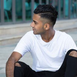 man with neat hair, fade hairstyle and side path