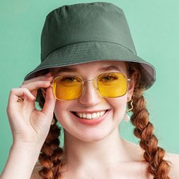 hair accessories: Happy smiling fashionable woman wearing yellow square sunglasses
