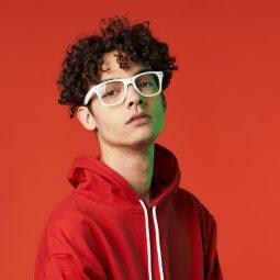 man with glasses and short curly hair