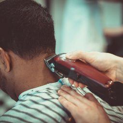 man in a barbershop getting his hair cut