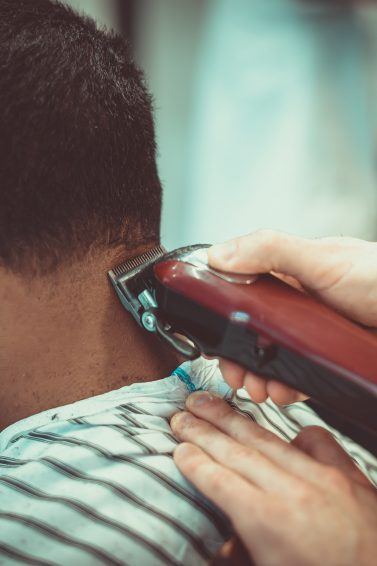 man in a barbershop getting his hair cut