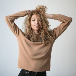 woman with blondish brown curly hair
