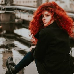 woman with a curly long red hair