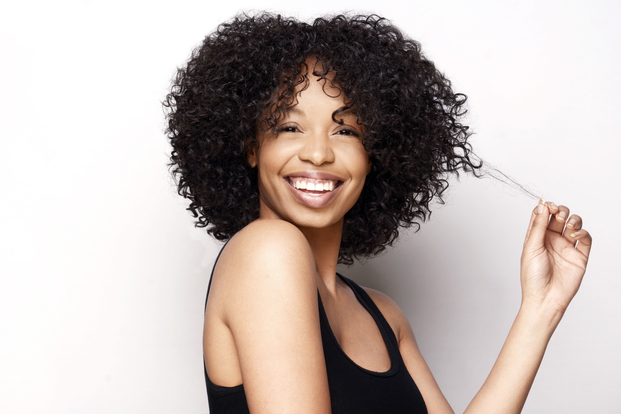 woman with big curly hair defined curls