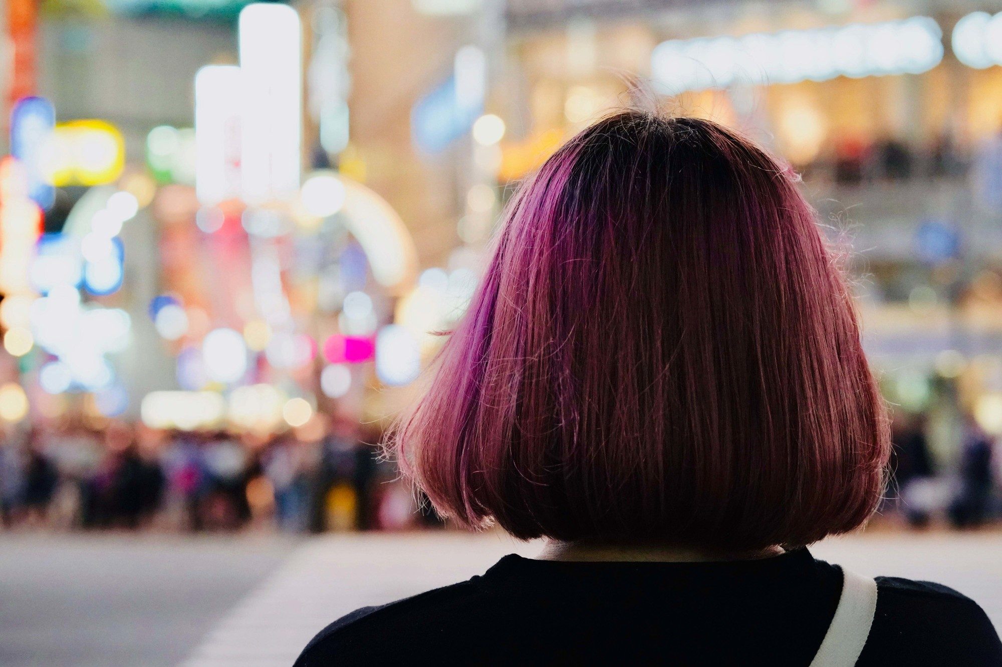 woman with bob haircut and mauve hair