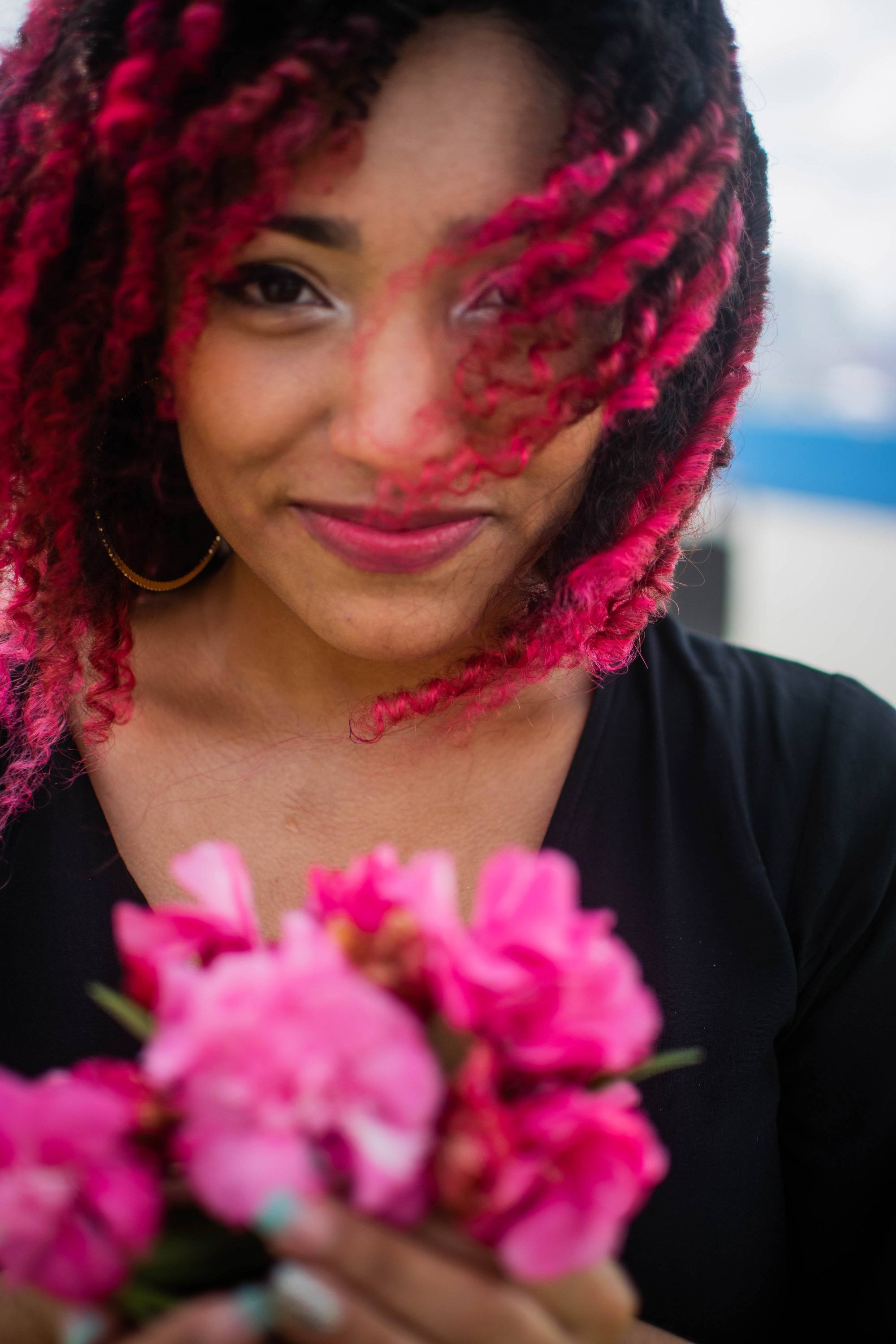 woman with bright pink dip dye hair