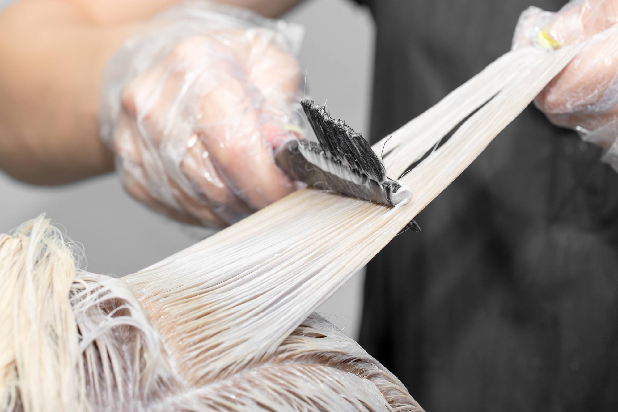 touch-up your roots: closeup of hair being bleached