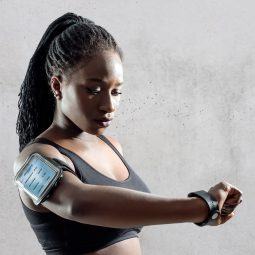 woman with protective hairstyle wearing gym workout clothing