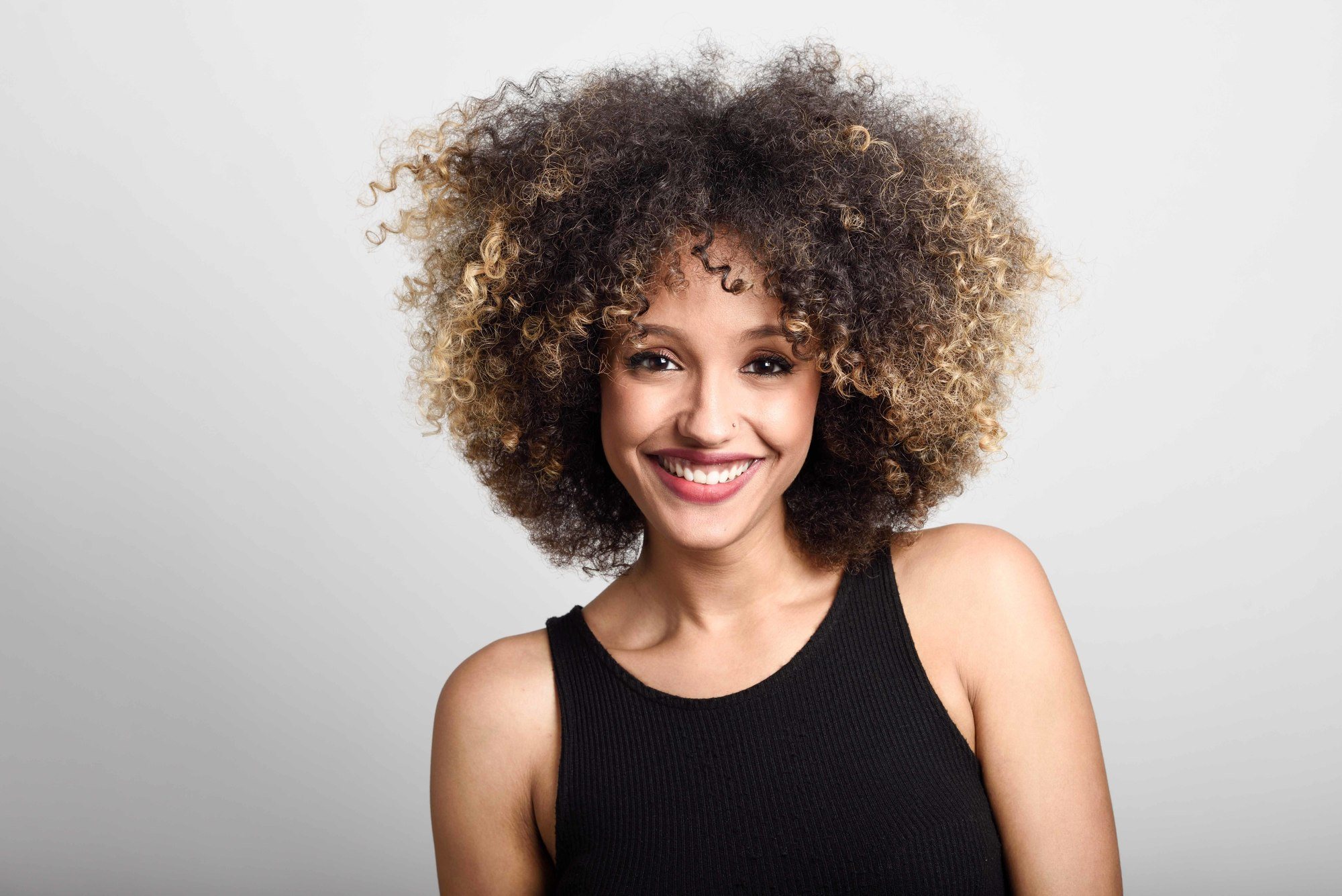 going blonde: woman with curly hair