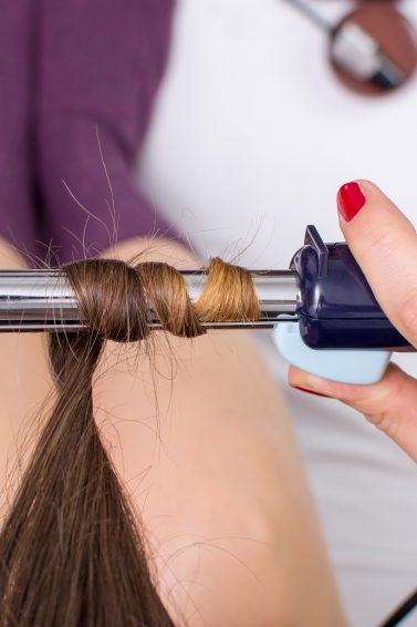 woman using a curling iron