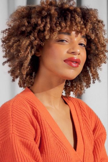 woman with a big curly afro