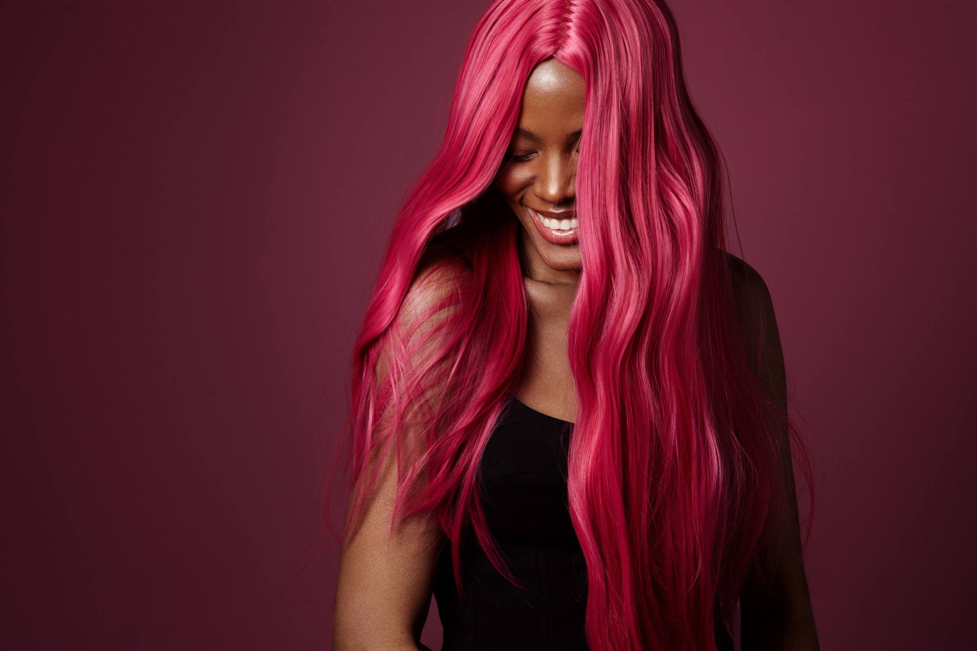 vibrant hair: black woman with hot pink dyed hair