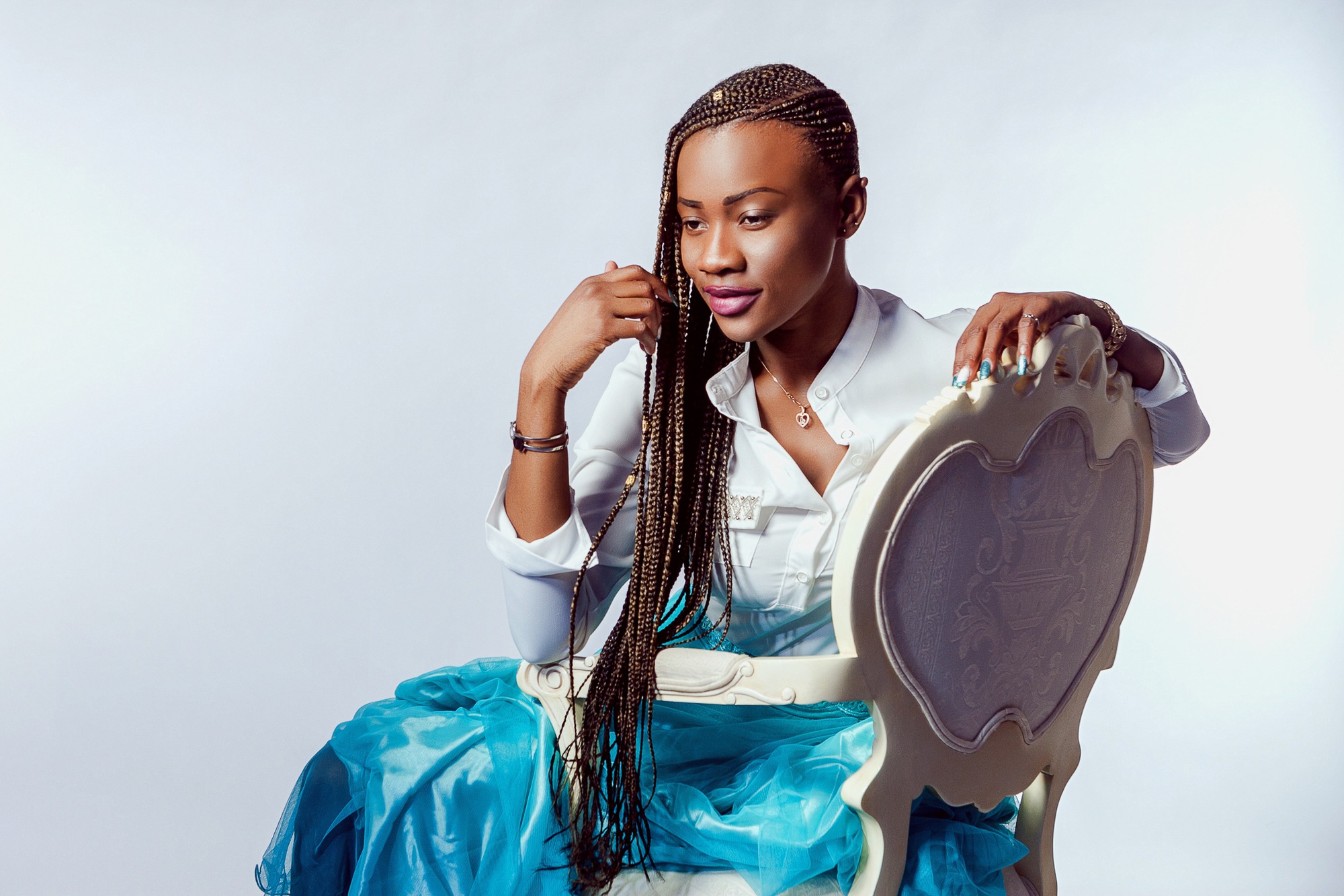 Woman wearing long side swept braids