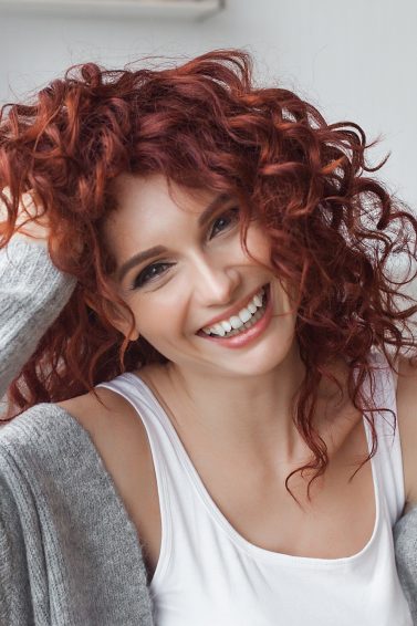 curl medium length hair: woman shoulder length, red curly hair