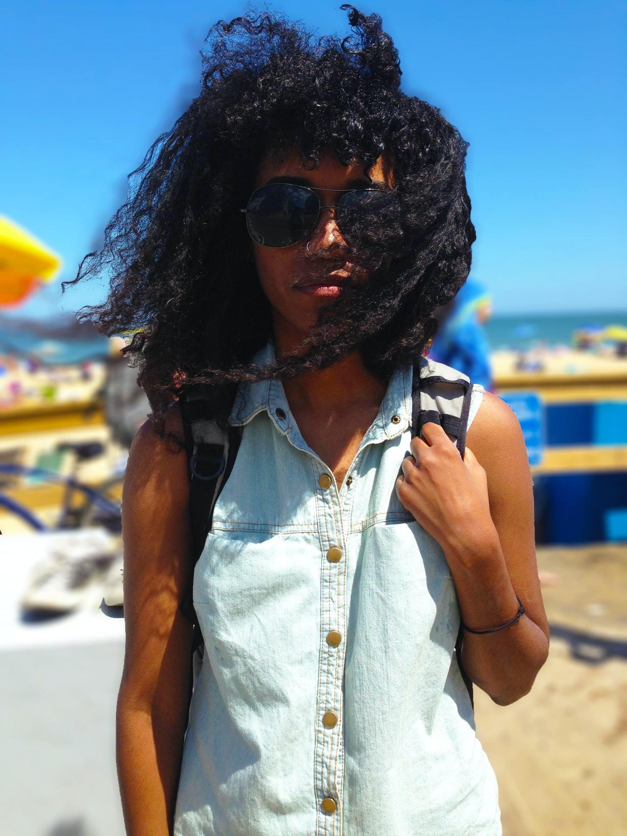 festive haircare: woman with black curly hair, look goof feel good