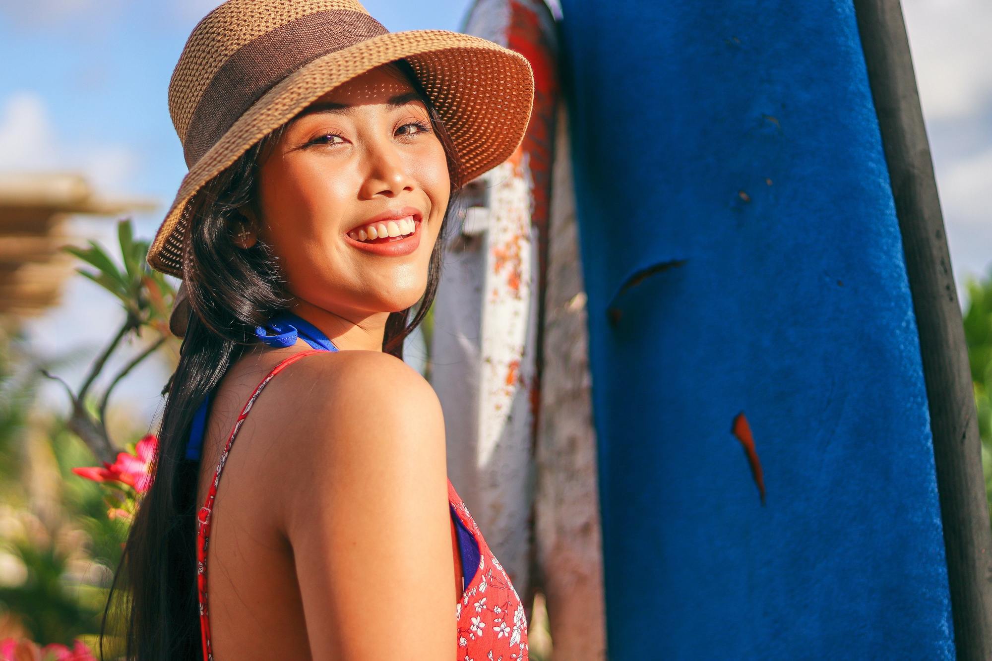 haircare tips: woman wearing a brown sun hat