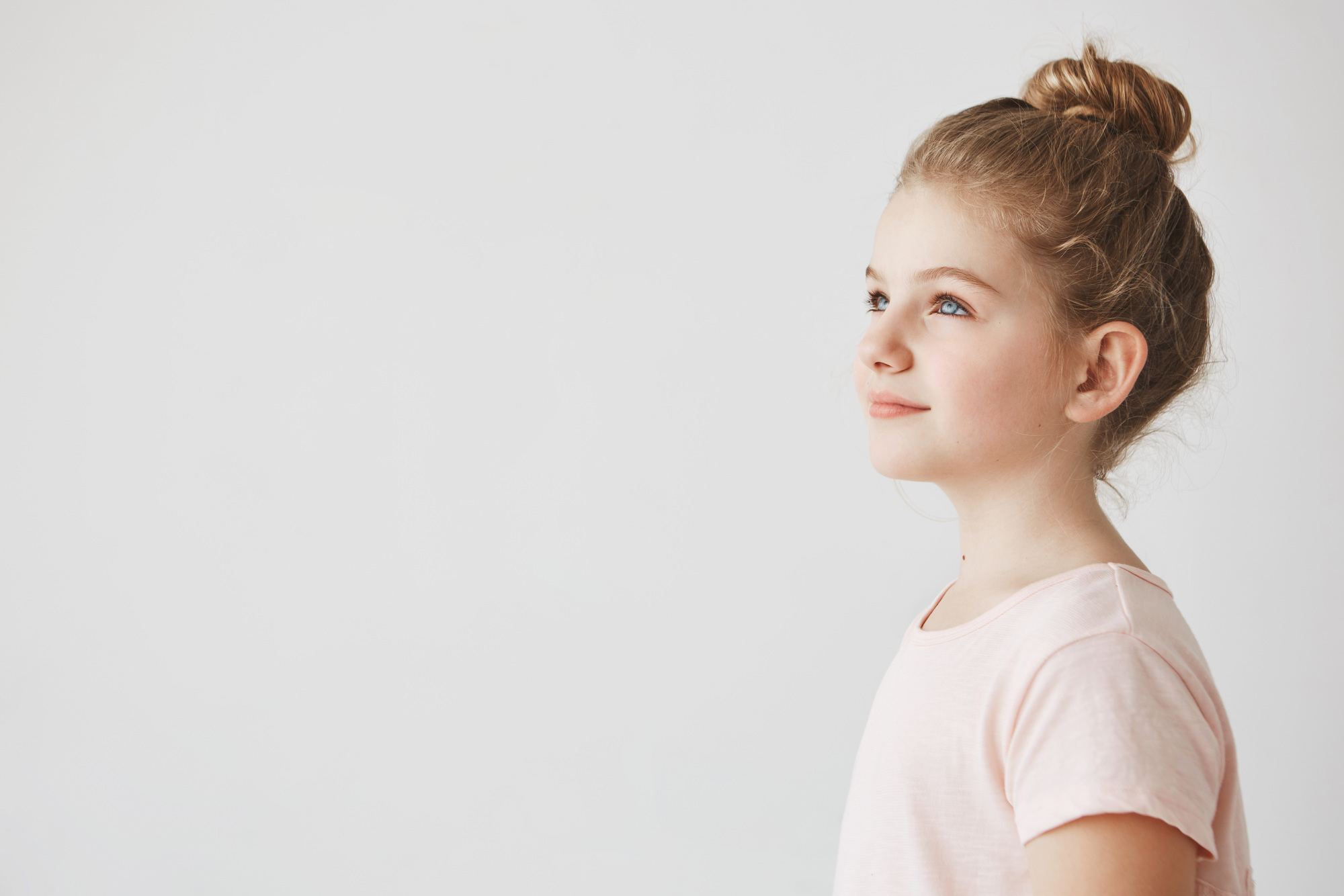 little girl with neat school high bun