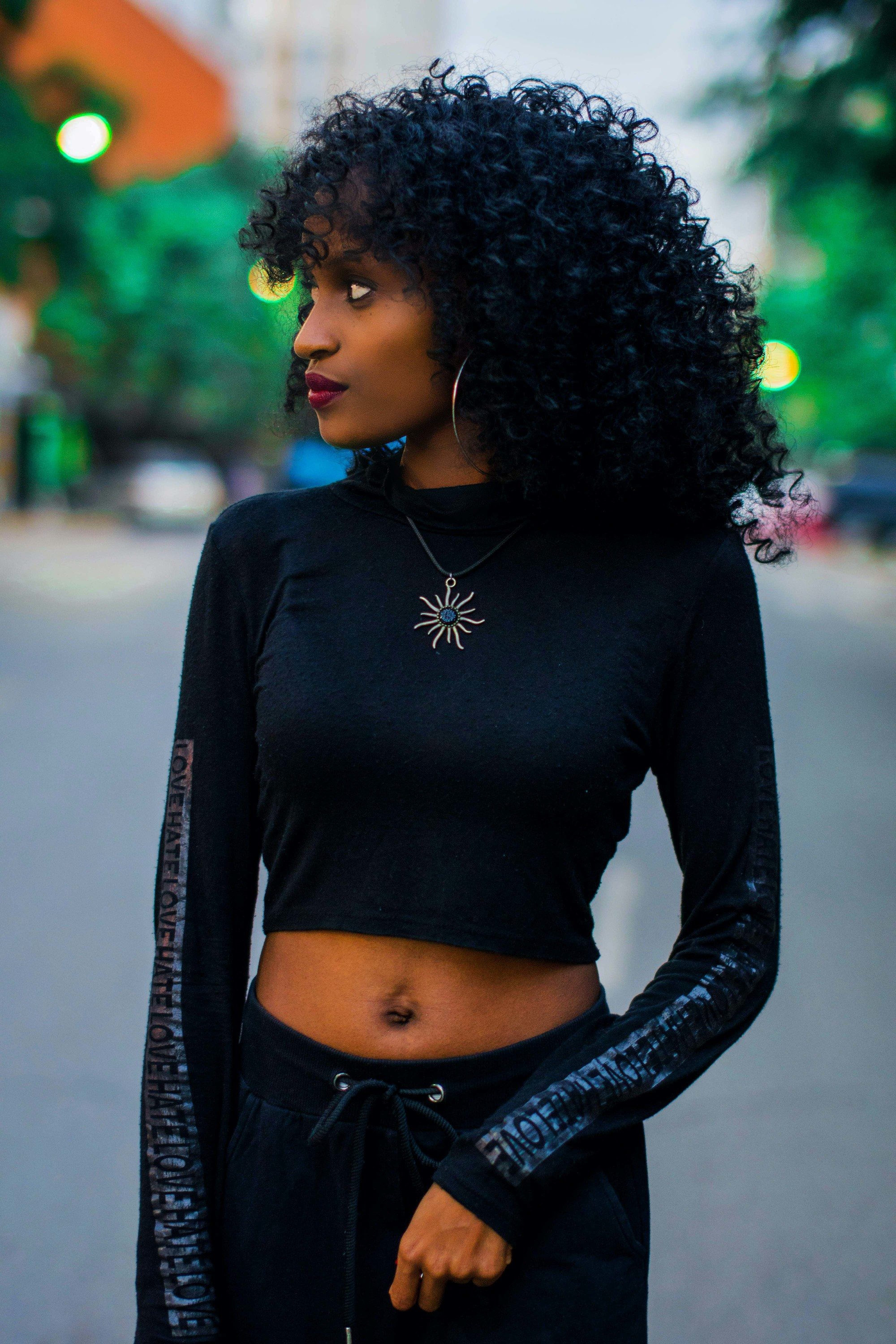 Woman with big curly bob and bangs