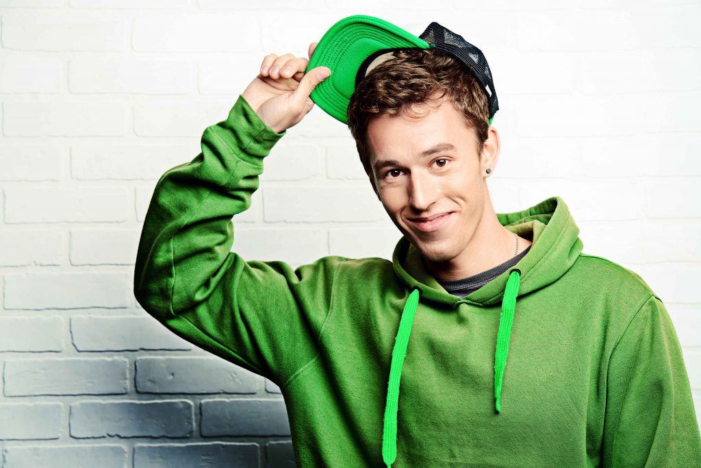man wearing a green hoodie and hat