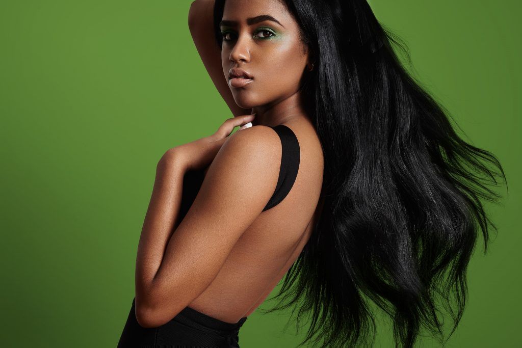 Woman with long blown out hair as an Aquarius hairstyle