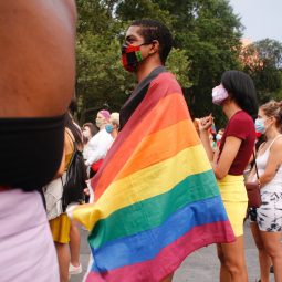 Man holding a Pride flag