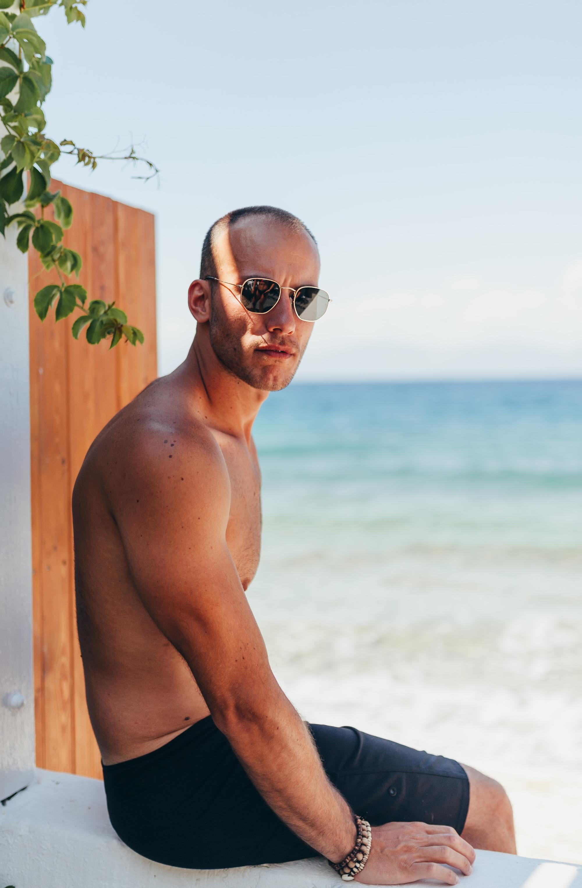 fuss-free men's hairstyles: Man at the beach with a buzzcut