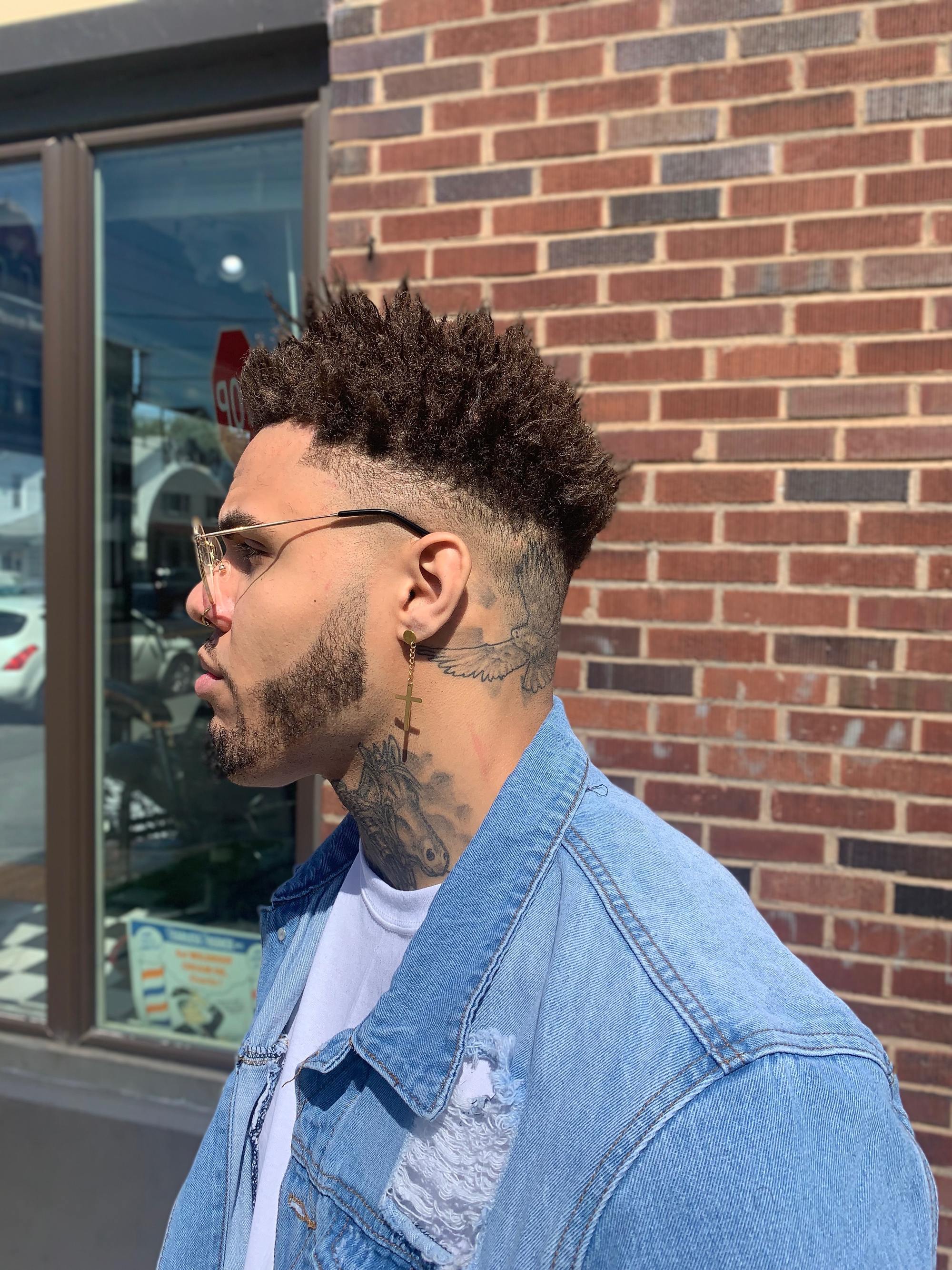 man with short, brown natural hair