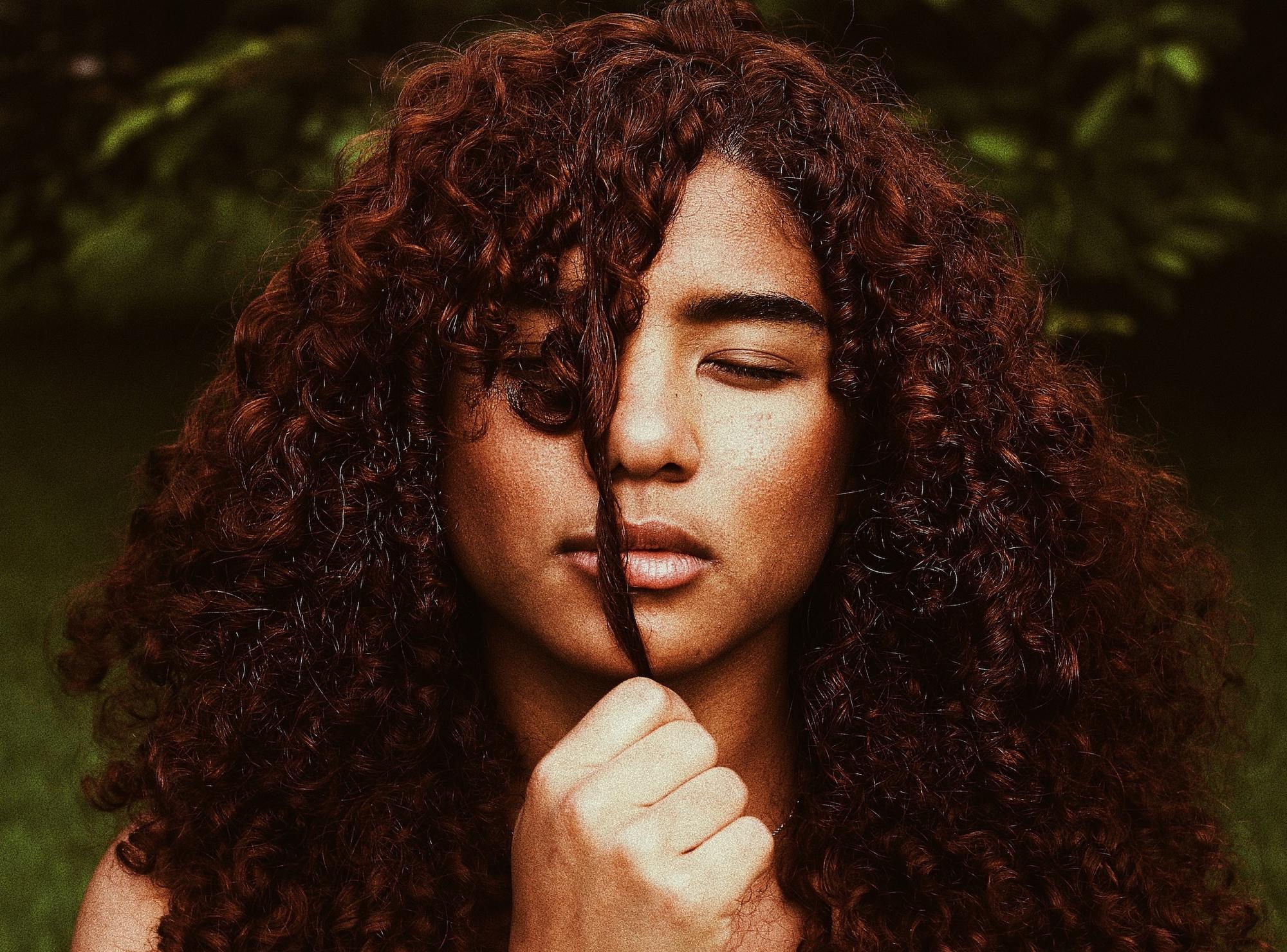 Woman with curly cinnamon hair