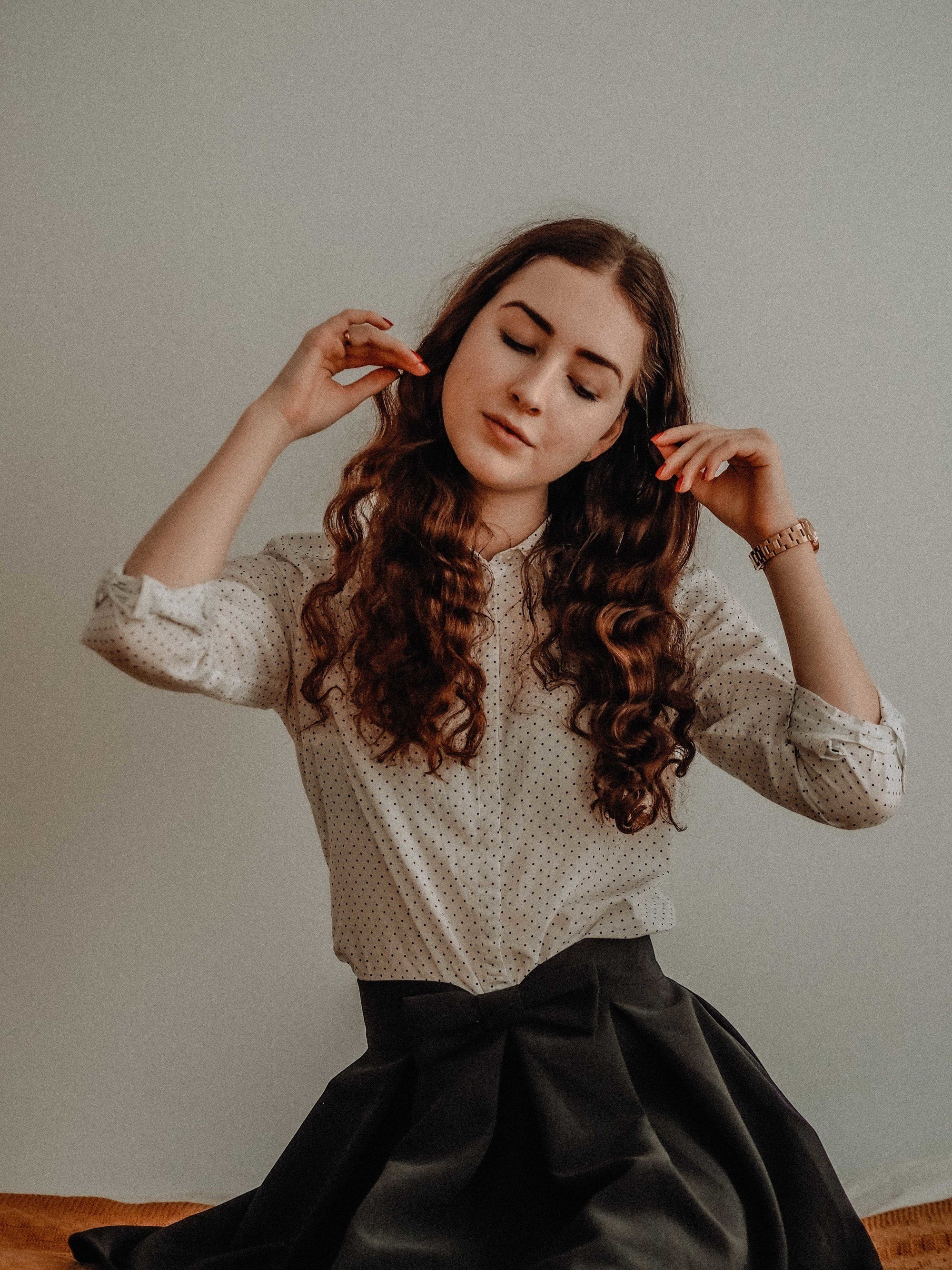 Woman with red-brown wavy hair