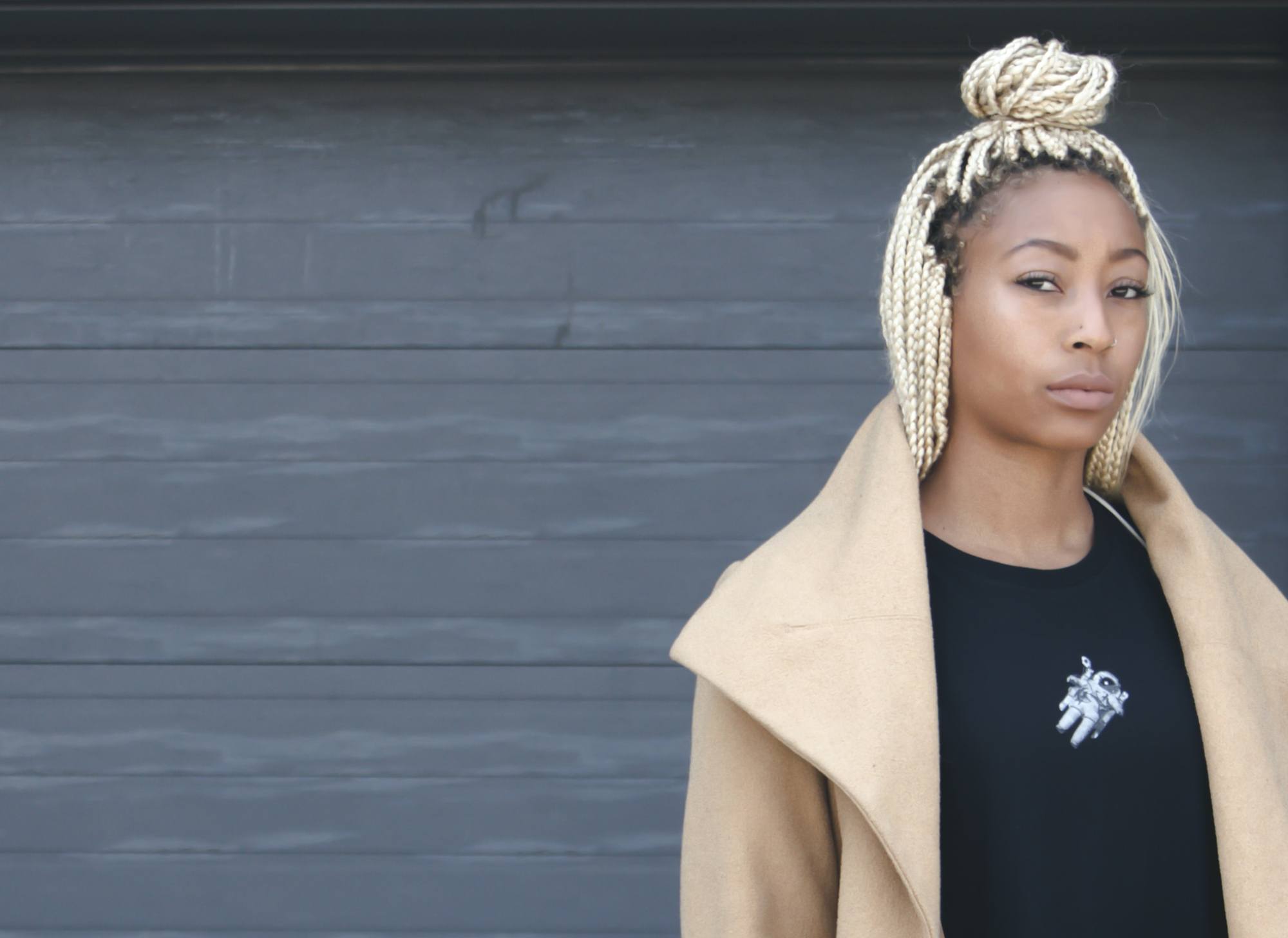 Women with blonde braid top knot