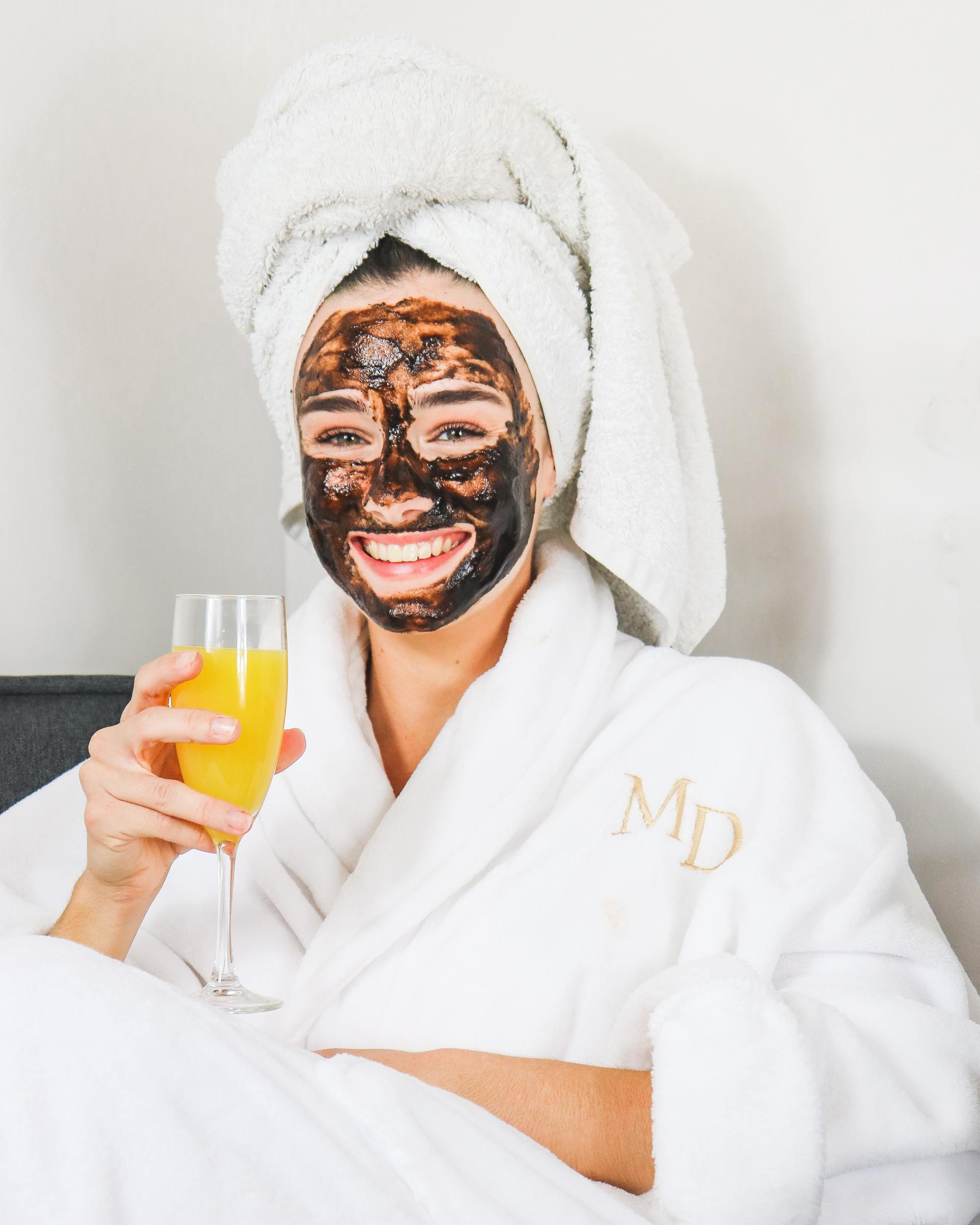 mental health awareness: woman wearing a face mask with her hair in a towel