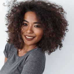 espresso hair colour: woman with voluminous naturally curly hair