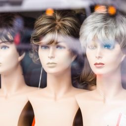Choosing the right wig: image of wigs in a store window